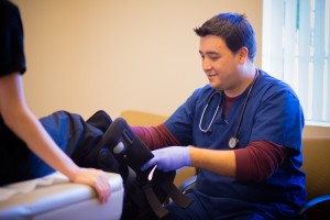 doctor working with patient's leg at the best Las Vegas urgent care